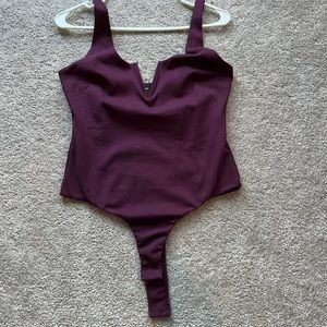 Purple body suit